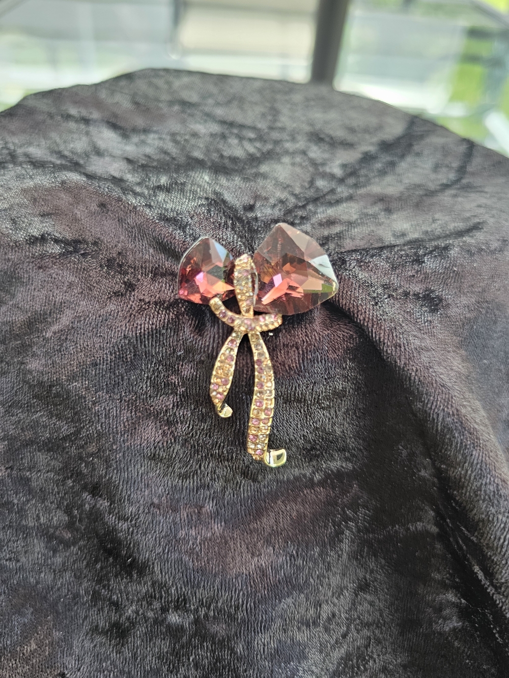 Pink Crystal little ones Bow Brooch with Gold Tone Accents and dark purple.